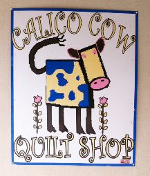 calico cow sign